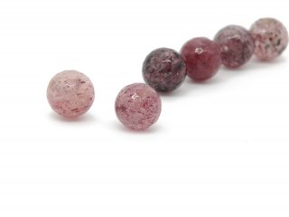 Two faceted strawberry quartz spheres