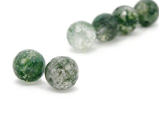 Two faceted, pierced green quartz balls