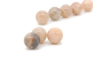 Three pierced, light brown moonstone beads