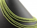 Peridot strand - faceted lentil 2x4 mm spring green,...
