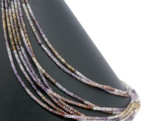 Pierced, faceted, coloured quartz rondelles
