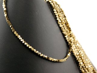 Pierced, sparkling, golden haematite spheres