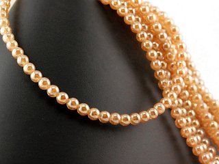 Pierced, glittering gemstone beads made of rock crystal