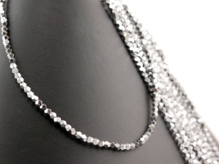 Shiny spheres of hematite in grey