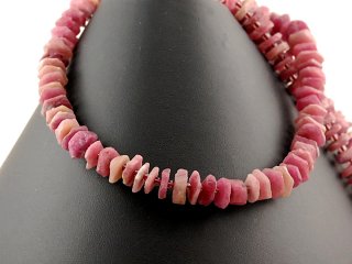 Pink-coloured, faceted, pierced tourmaline cubes