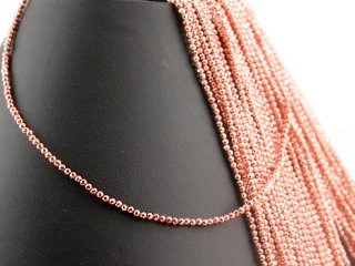 Pierced, faceted, rose gold haematite spheres