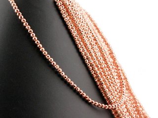 Pierced, faceted, rose gold haematite spheres