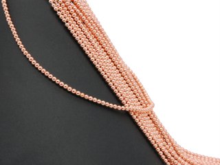 Pierced, rose gold haematite spheres