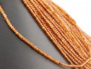 Garnet strand - faceted rondelle 2x3mm amber orange,...