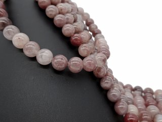 Pierced strawberry quartz spheres
