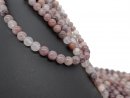 Pierced strawberry quartz spheres
