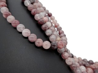 Pierced strawberry quartz spheres