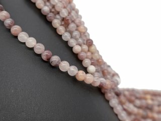 Pierced strawberry quartz spheres