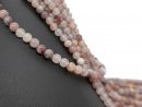 Pierced strawberry quartz spheres