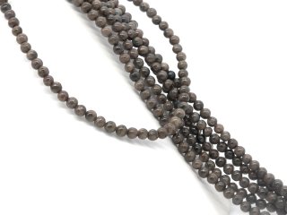 Shimmering, brown-grey, pierced feldspar spheres