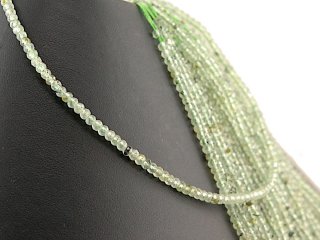 Green, faceted, pierced garnet rondelle