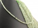 Green garnet strand - faceted rondelles 2x3 mm pale...