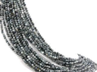 Faceted, pierced hawks eye spheres