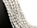Howlite strand - faceted drops 8x12 mm white marbled,...