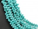 Howlite strand - faceted drops 6x9 mm turquoise, lenght...