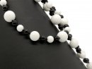 Onyx and howlite strand - spheres, 8-16 mm black and...