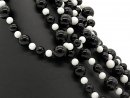 Onyx and howlite strand - spheres, 8-16 mm black and...