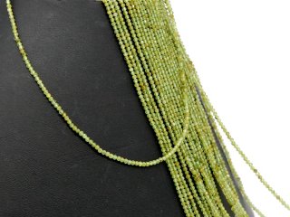 Green, faceted garnet for jewellery