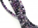 Pierced, purple fluorite beads