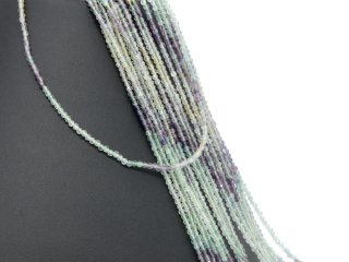 Pierced, faceted fluorite beads in violet and green