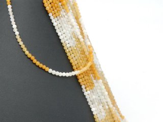 Boules de pierres précieuses facettées en jaune et blanc