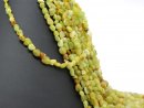 Green garnet strand - natural cut 6x7 mm bright green,...