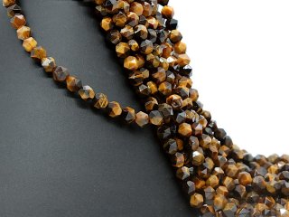 Tiger eye - roughly faceted 7x9 mm golden brown, length 39 cm /2369