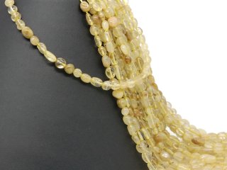 Pierced citrine nuggets in yellow