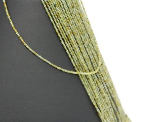 Green, pierced, faceted garnet lenses