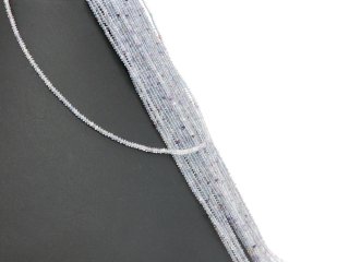Pierced, faceted fluorite lenses in blue and purple