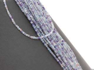 Pierced, faceted fluorite rondelles in blue and purple