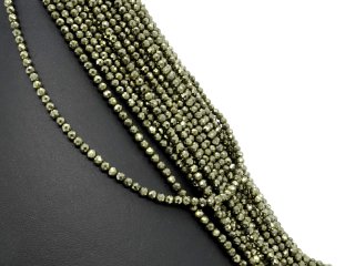 Faceted, pierced pyrite spheres in gold green