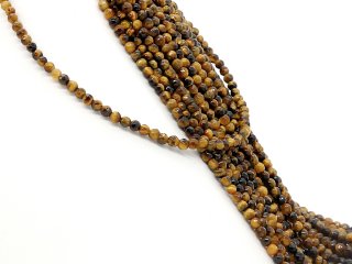 Pierced, faceted tigers eye beads in golden brown