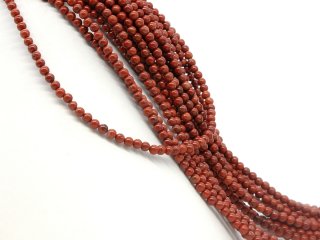 Red, pierced jasper beads