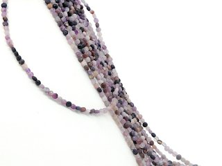 Disques de fluorite percés et facettés en lilas