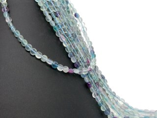 Pierced, violet and green fluorite discs with facets