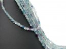 Pierced, violet and green fluorite discs with facets