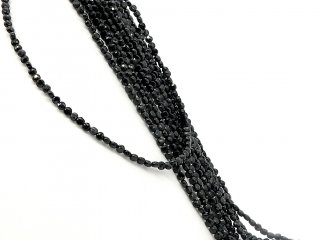 Faceted, black, pierced onyx discs