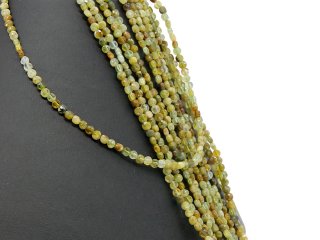 Green, faceted, pierced garnet discs