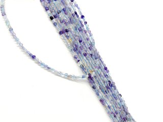 Pierced, violet, green and yellow fluorite discs with facets