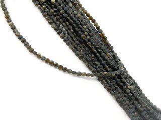 Durchbohrte, facettierte Scheiben aus Obsidian