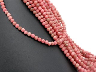 Perles roses étincelantes en rhodochrosite