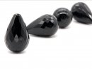 A pierced, black onyx drop with facets