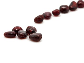 Five red pierced garnet stones