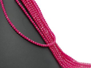 Faceted, pierced rubellite spheres